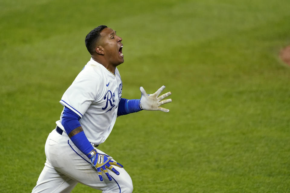 Kansas City Royals' Salvador Perez celebrates after hitting a single to drive in the winning run during the ninth inning of the team's baseball game against the Tampa Bay Rays on Wednesday, April 21, 2021, in Kansas City, Mo. The Royals won 9-8. (AP Photo/Charlie Riedel)