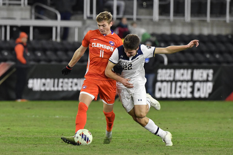 Clemson midfielder Brandon Parrish (11) and Notre Dame midfielder Nolan Spicer (22) battle for the ball during the second half of the NCAA college soccer tournament championship game in Louisville, Ky., Monday, Dec. 11, 2023. (AP Photo/Timothy D. Easley)