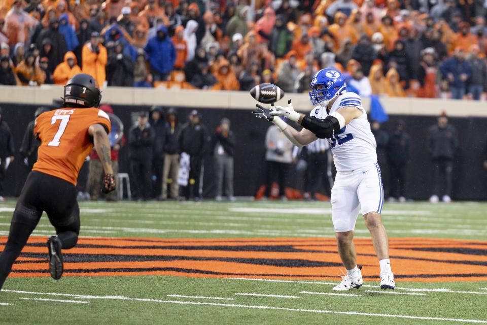 BYU defensive end Tyler Batty (92) catches the ball during a fake punt in the first half of an NCAA college football game against Oklahoma State Saturday, Nov. 25, 2023, in Stillwater, Okla. | Mitch Alcala, Associated Press