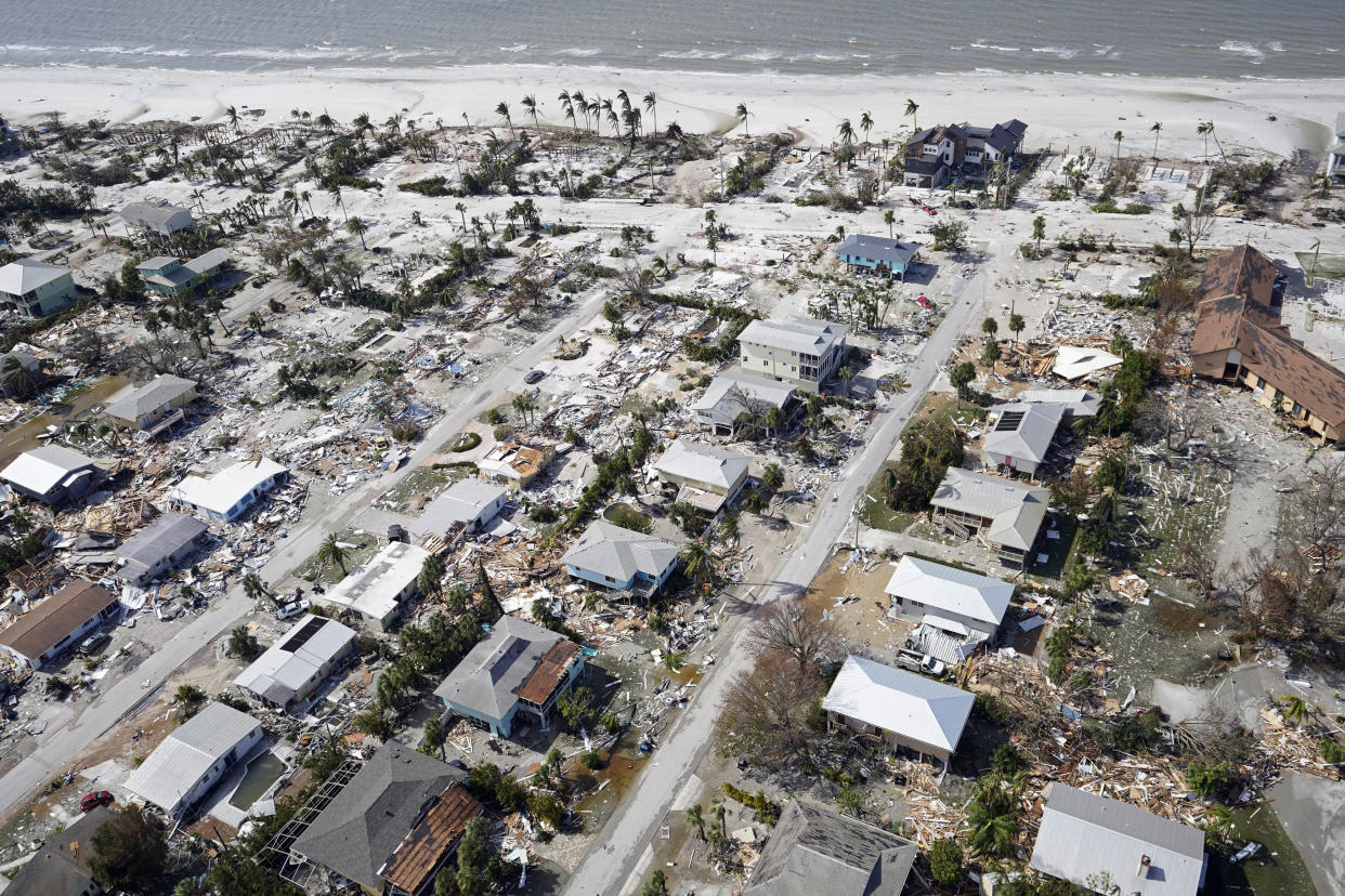 An aerial photo of damaged homes and debris in the aftermath of Hurricane Ian.