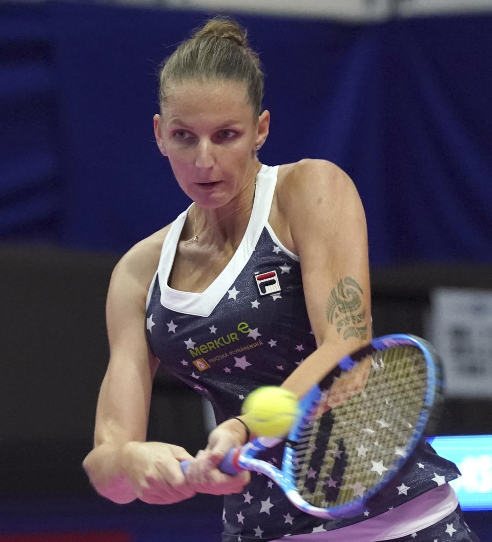 Karolina Pliskova, of Czech Republic returns a shot against Naomi Osaka, of Japan during the final match of the Pan Pacific Open women's tennis tournament in Tokyo Sunday, Sept. 23, 2018. (AP Photo/Eugene Hoshiko)