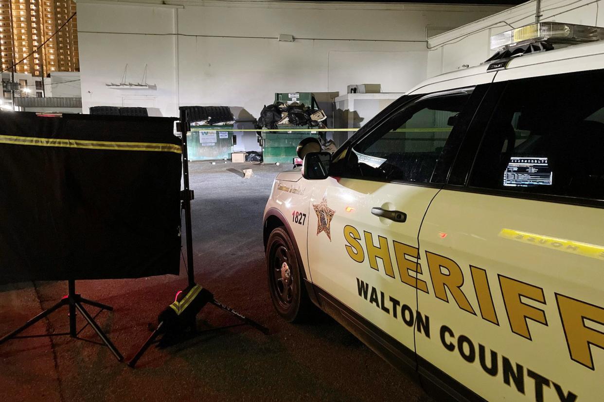 Walton County Sheriff's Office deputies work the scene of an officer-involved shooting on Poinciana Boulevard in Miramar Beach late Tuesday.