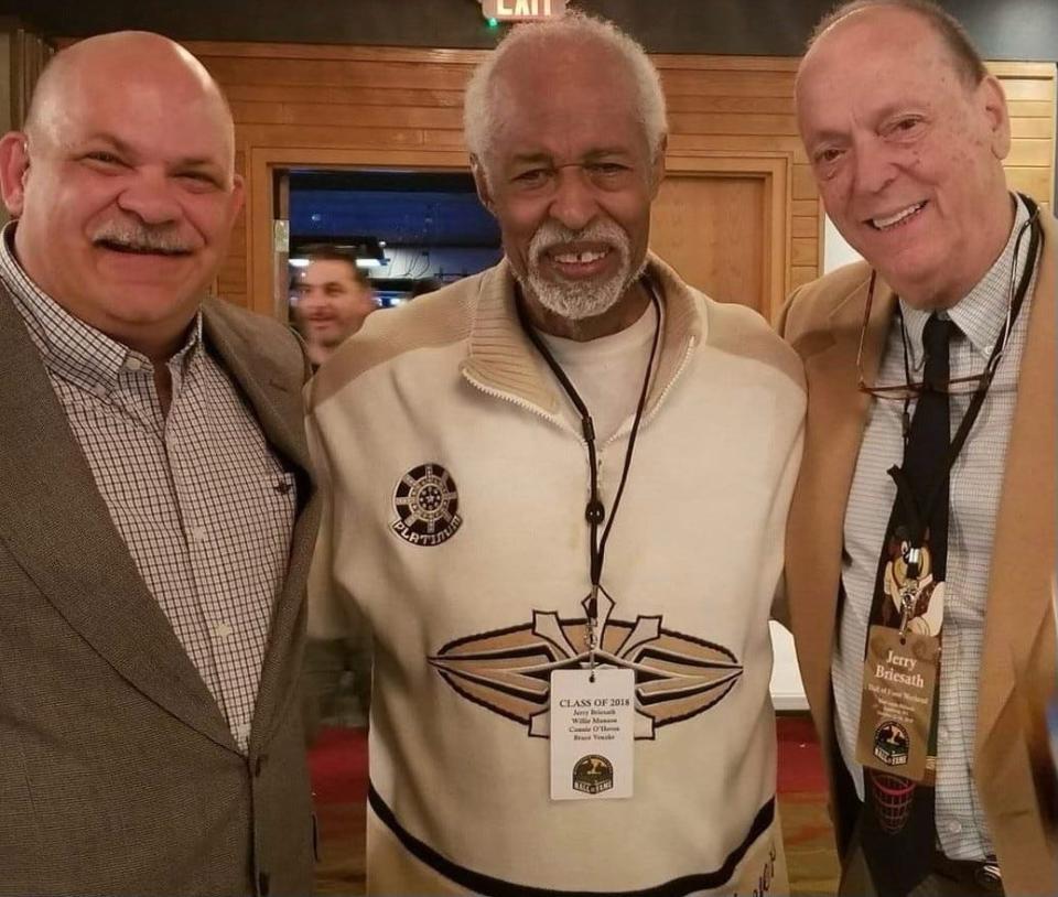 Willie Munson, a Wisconsin Billiards Hall of Fame Class of 2018 inductee, gathers for a photo that includes fellow inductee Jerry Breiseth, right.