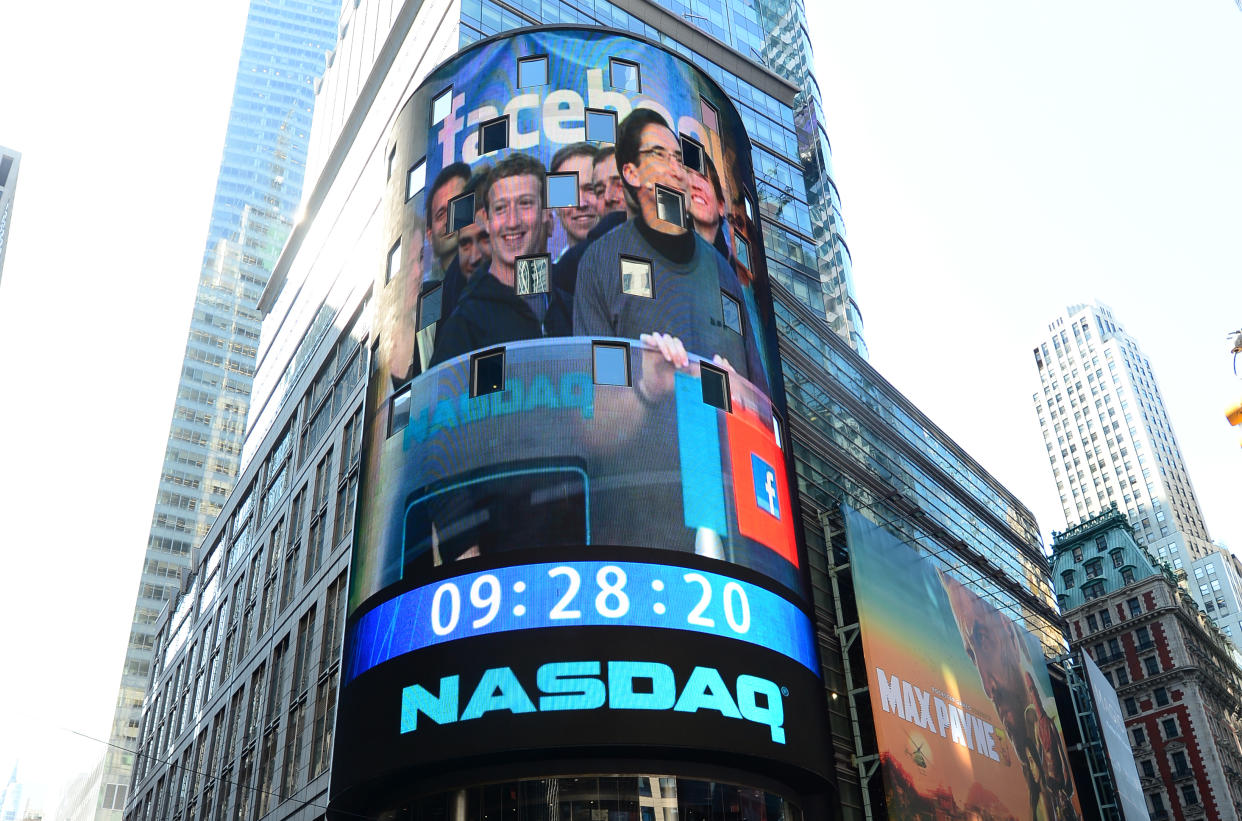 Facebook co-founder Mark Zuckerberg is seen on a screen getting ready to ring the NASDAQ stock exchange opening bell in Times Square in New York, May 18, 2012. Facebook is set to go public on May 18, 2012 and is likely to have an estimated market valuation of over 100 billion USD when its shares begin trading on the NASDAQ. AFP PHOTO/Emmanuel Dunand        (Photo credit should read EMMANUEL DUNAND/AFP via Getty Images)