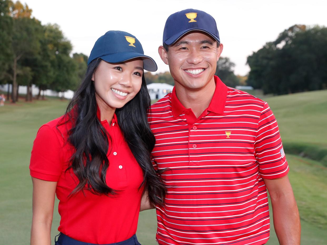 Collin Morikawa poses for a photo with his girlfriend Katherine Zhu after Team USA won the 2022 Presidents Cup on September 25, 2022 at Quail Hollow Club in Charlotte, North Carolina