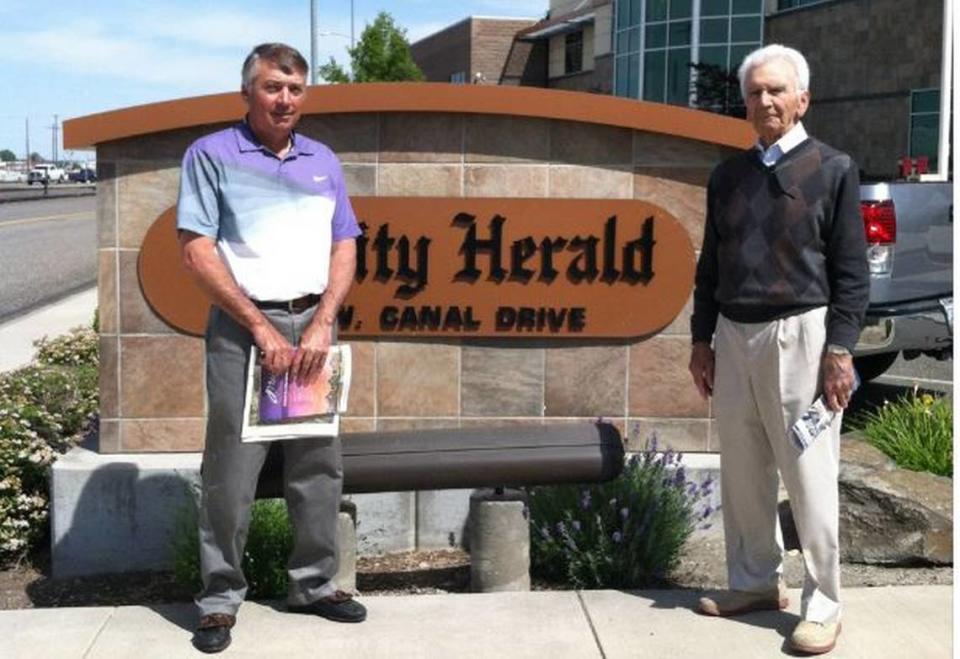 Bob Philip, right, co-founder of the Tri-City Herald, is pictured with his son, also named Bob, on a visit to the Herald a few years ago.