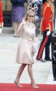 <p>It was this Philip Treacy hat that still haunts Beatrice today. The royal wore a Valentino coat dress in the same pale pink shade.<em> [Photo: Getty]</em> </p>