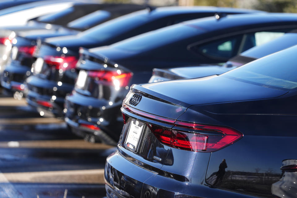 FILE - Unsold 2023 sedans sit in a long row at an Audi dealership Sunday, Feb. 11, 2024, in Broomfield, Colo. On Tuesday, the Labor Department issues its report on inflation at the consumer level in January. (AP Photo/David Zalubowski)