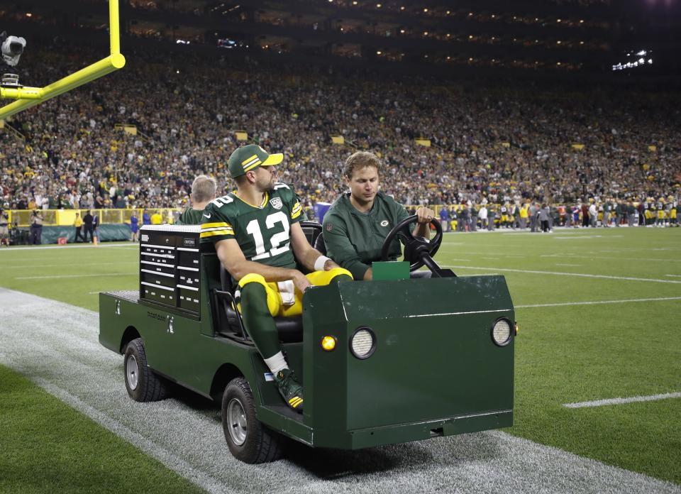 Green Bay Packers' Aaron Rodgers is taken off the field on a cart after injuring his leg during the first half of an NFL football game against the Chicago Bears Sunday, Sept. 9, 2018, in Green Bay, Wis. (AP Photo/Jeffrey Phelps)