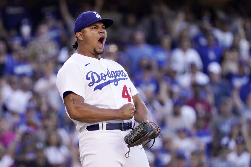 Los Angeles Dodgers relief pitcher Brusdar Graterol celebrates after striking out San Diego Padres' Manny Machado.