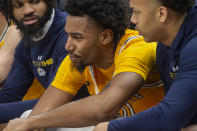 Kent State's Julius Rollins, center, reacts between unidentified teammates after committing a foul against Akron during the second half of an NCAA college basketball game in the championship of the Mid-American Conference tournament, Saturday, March 16, 2024, in Cleveland. (AP Photo/Phil Long)