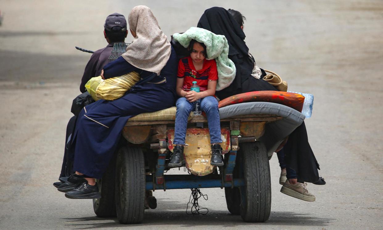 <span>People travel on a cart in Rafah, Gaza’s southernmost city, on Friday.</span><span>Photograph: AFP/Getty Images</span>