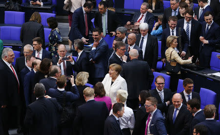 German Chancellor Angela Merkel reacts after being re-elected as chancellor during a session of the German lower house of parliament Bundestag in Berlin, Germany, March 14, 2018. REUTERS/Hannibal Hanschke