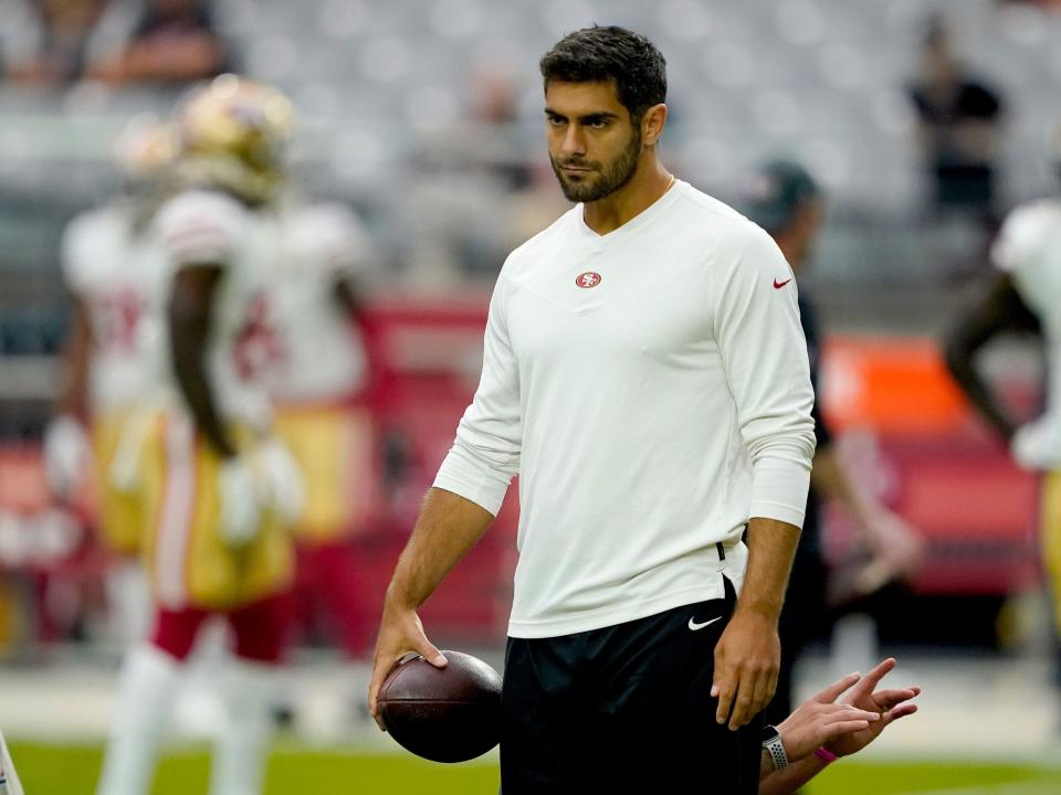 Jimmy Garoppolo watches warmups before a game against the Arizona Cardinals.