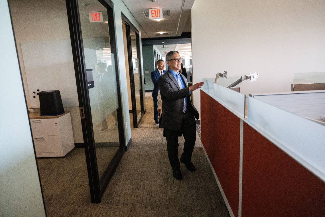 Chris Lee, of the California Department of Tax and Fee Administration, tours his office area at the May S. Lee State Office Complex on April 24, its grand opening. Chris Lee is the nephew of the late May Lee.