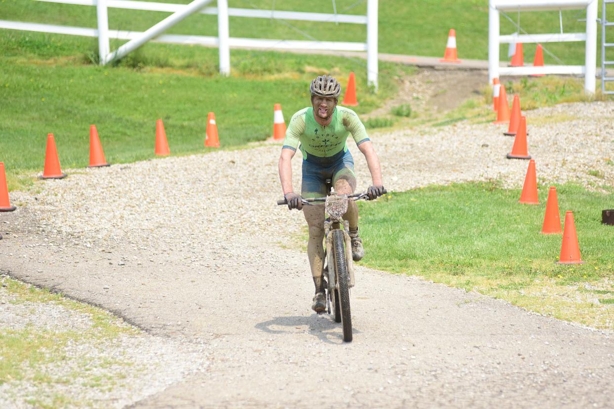 Jeff Pendlebury of Shreve in Wayne County finishes third overall Saturday during the 100 kilometer event during the Mohican Mountain Bike race.