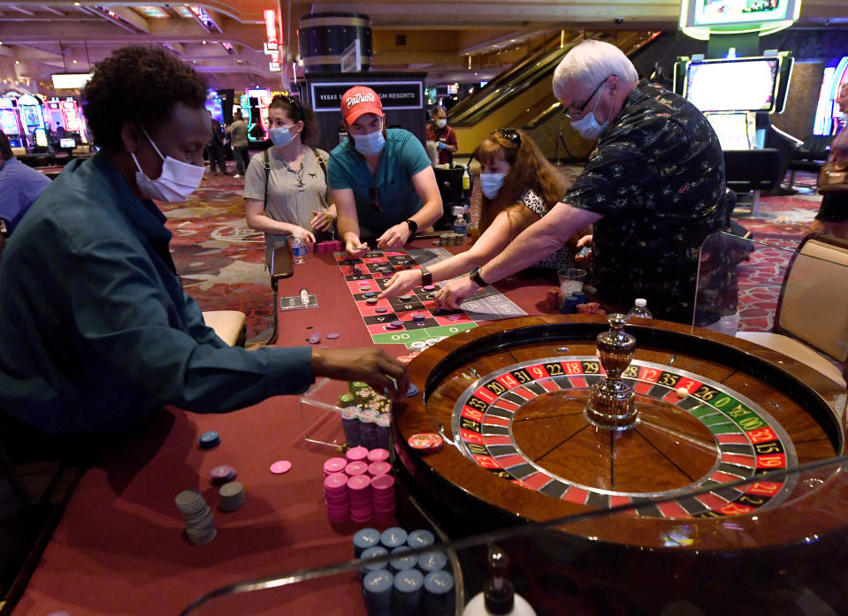 LAS VEGAS, NEVADA - JUNE 11:  Guests play roulette at Excalibur Hotel &amp; Casino after the Las Vegas Strip property opened for the first time since being closed in mid-March because of the coronavirus (COVID-19) pandemic on June 11, 2020 in Las Vegas, Nevada. Hotel-casinos throughout the state were allowed to open on June 4 as part of a phased reopening of the economy with social distancing guidelines and other restrictions in place. Excalibur is MGM Resorts International's fourth Las Vegas location to reopen for business following its Bellagio Resort &amp; Casino, New York-New York Hotel &amp; Casino, MGM Grand Hotel &amp; Casino and The Signature properties on June 4.  (Photo by Ethan Miller/Getty Images)