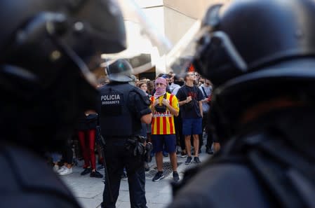 Protesters gather as Ciudadanos party leader Albert Rivera visits the Saudade centre in Barcelona