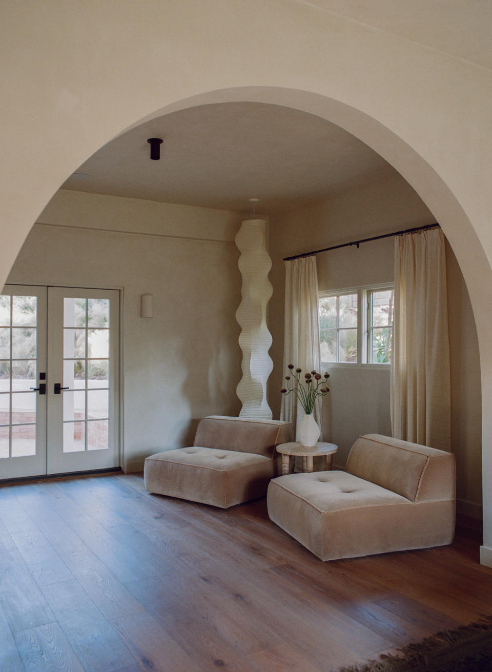 A bedroom with paper floor lamp