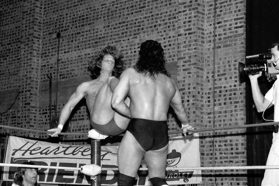 December 14, 1987: Wrestling match between Al Perez, right, and Kevin Von Erich at Will Rogers Coliseum, Fort Worth, Texas. Kerry Von Erich is seen outside of the ring at lower left.