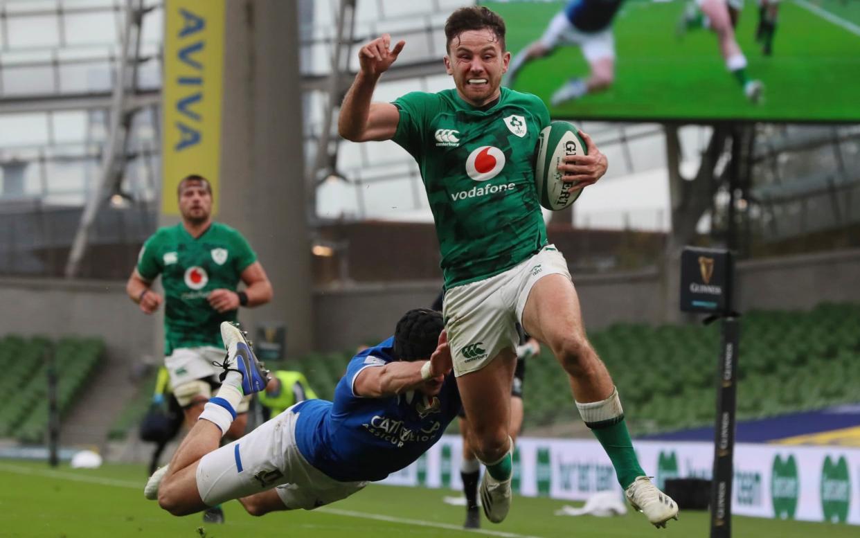 Italy's Carlo Canna fails to stop Ireland's Hugo Keenan as he runs towards the line to score a try during the Six Nations rugby union international match between Ireland and Italy at the Aviva Stadium in Dublin, Ireland, Saturday, Oct. 24, 2020.  - AP