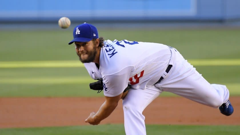 Los Angeles Dodgers starting pitcher Clayton Kershaw throws to the plate during a baseball game.