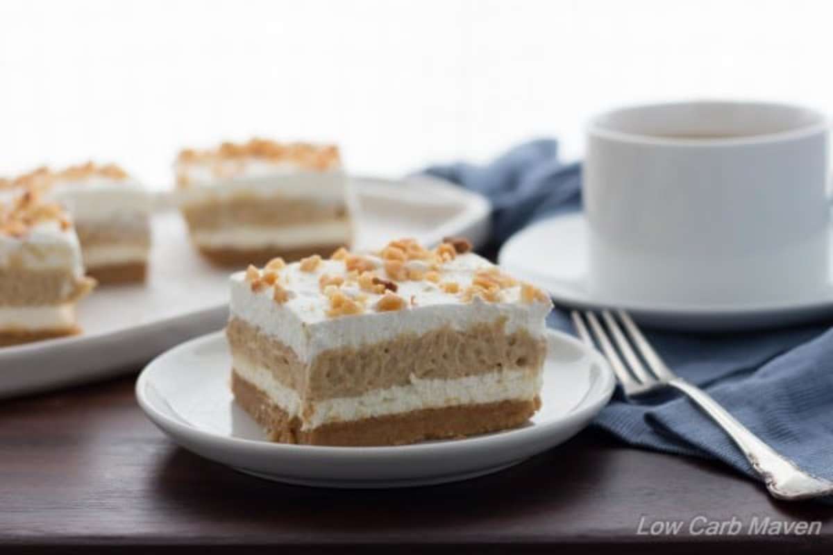 <p>Low Carb Maven</p><p>This low-carb Peanut Butter Layered Dream is ketogenic culinary heaven! Roasted peanut flour crust, silky sweetened cream cheese, rich peanut butter pudding and whipped cream!</p><p><a href="https://www.lowcarbmaven.com/low-carb-peanut-butter-layered-dream/" rel="nofollow noopener" target="_blank" data-ylk="slk:Get the recipe!;elm:context_link;itc:0;sec:content-canvas" class="link rapid-noclick-resp">Get the recipe!</a></p>