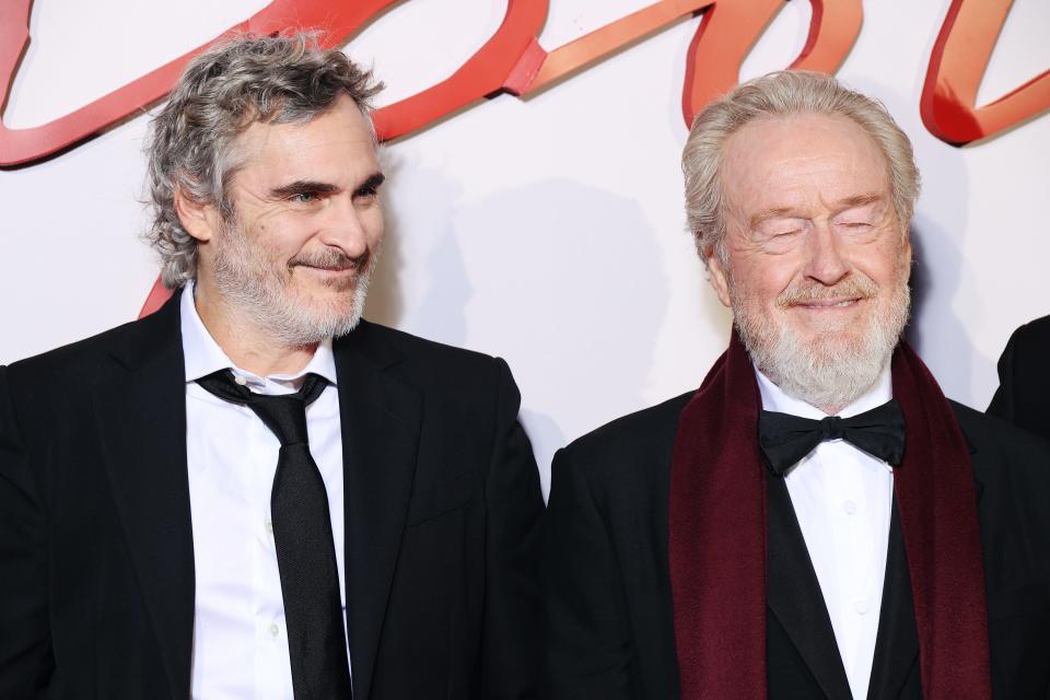 Joaquin Phoenix and Director Ridley Scott attend the Tuesday "Napoleon" World Premiere at Salle Pleyel in Paris, France.