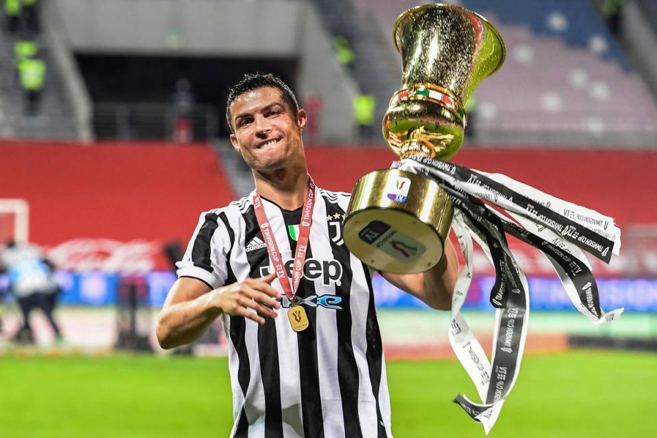 Juventus' Portuguese forward Cristiano Ronaldo holds the cup after Juevntus won the final of the Italian Cup (Coppa Italia) football match Atalanta vs Juventus at the Citta del Tricolore stadium in Reggio Emilia. (AFP via Getty Images)