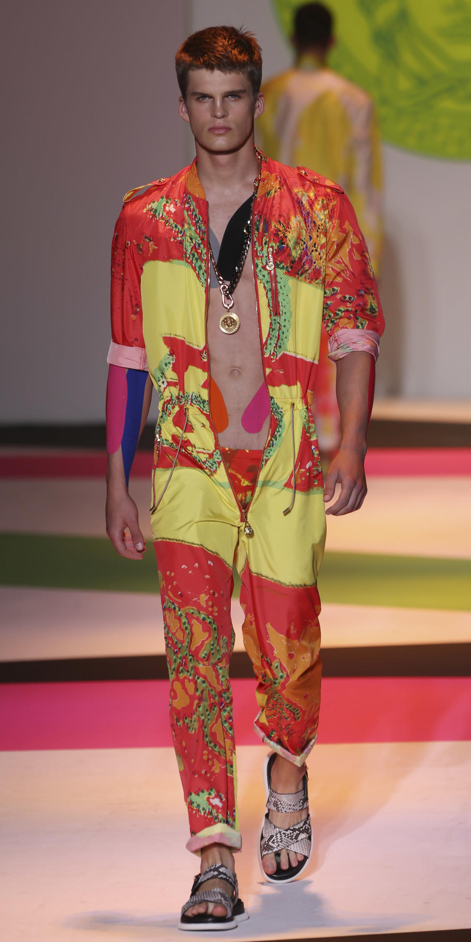 A model wears a creation of the Versace men's Spring-Summer 2014 collection, part of the Milan Fashion Week, unveiled in Milan, Italy, Saturday, June 22, 2013. (AP Photo/Luca Bruno)