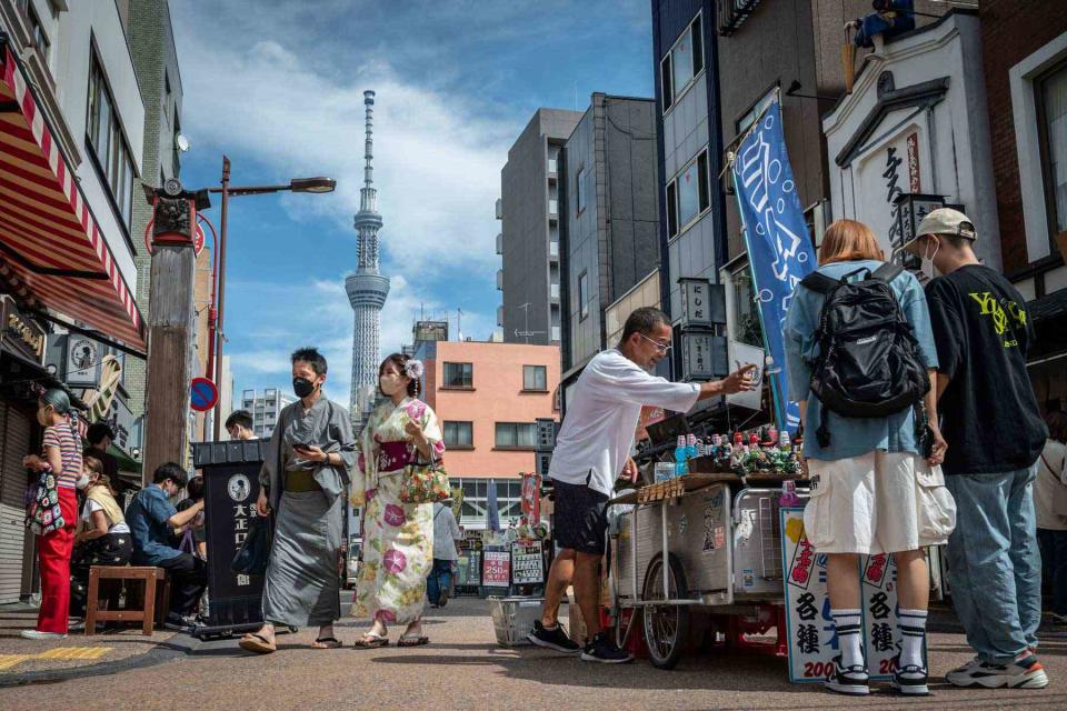 <p>YUICHI YAMAZAKI/AFP via Getty Images</p> People visit the Asakusa area, a popular tourist location, in Tokyo on September 13, 2022.