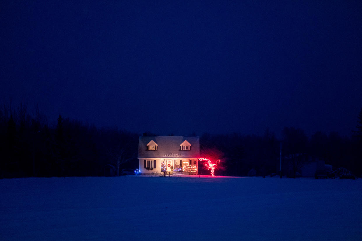 Solo home lit up with Christmas lights