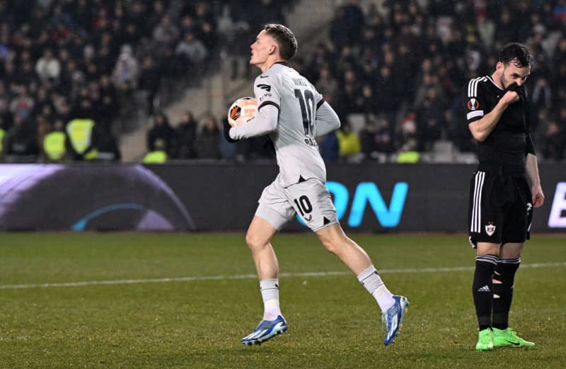 Leverkusen's Florian Wirtz celebrates scoring his side's first goal during the UEFA Europa League round of 16 first leg soccer match between FK Karabakh Agdam and Bayer Leverkusen at Tofiq Bahramov Stadium. Federico Gambarini/dpa