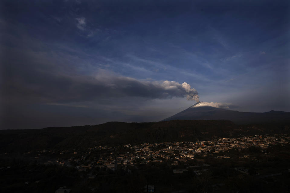 The Popocatepetl volcano spews ash and steam, seen from Santiago Xalitzintla, Mexico, Wednesday, May 24, 2023. (AP Photo/Marco Ugarte)