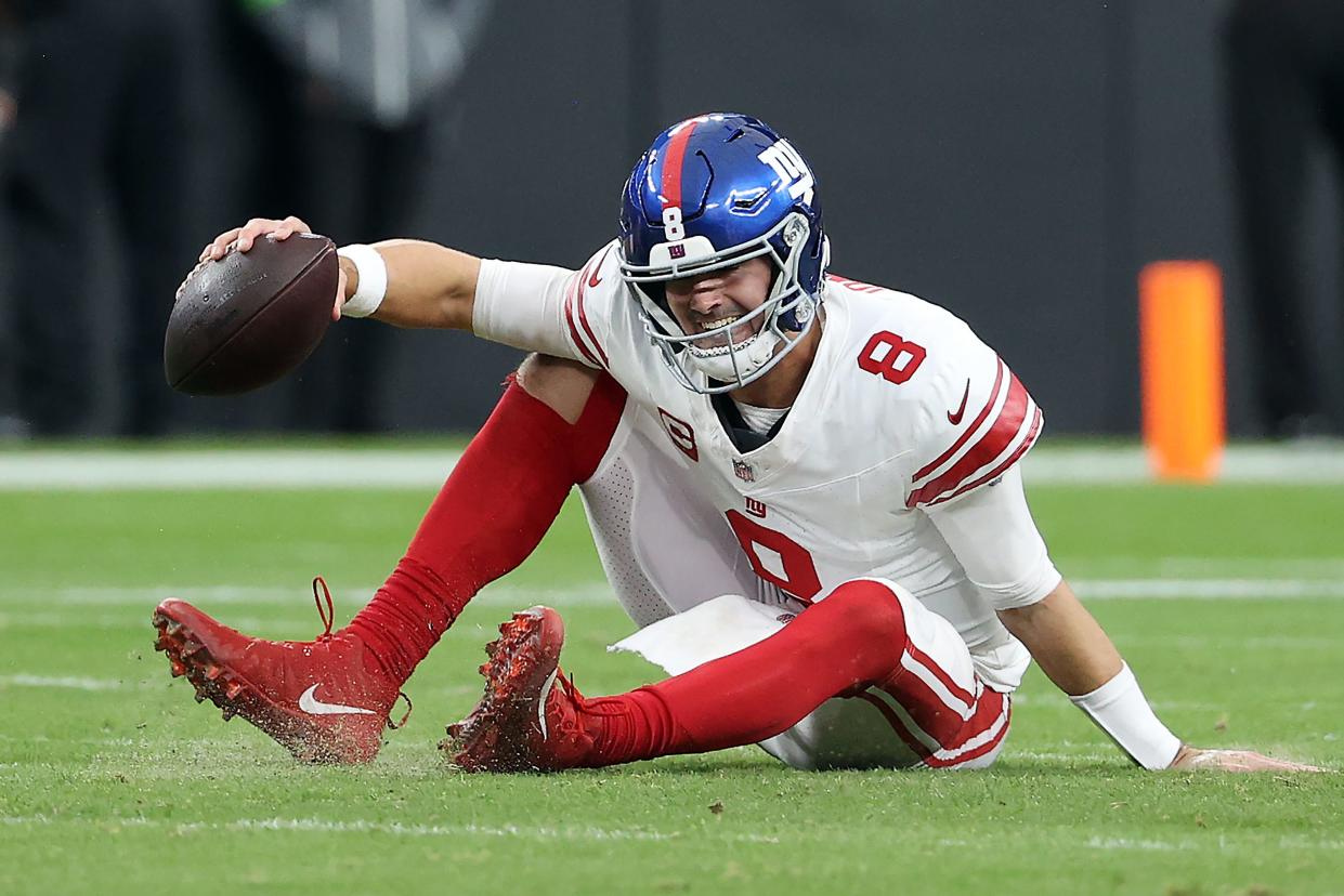 Daniel Jones of the New York Giants reacts after falling down in the first quarter of a game against the Las Vegas Raiders at Allegiant Stadium on November 05, 2023 in Las Vegas, Nevada.
