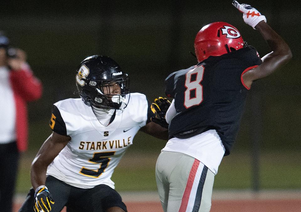 Starkville's Braylon Burnside (5) defends against the Clinton Arrows in Clinton, Miss., Friday, Sept. 30, 2022. 