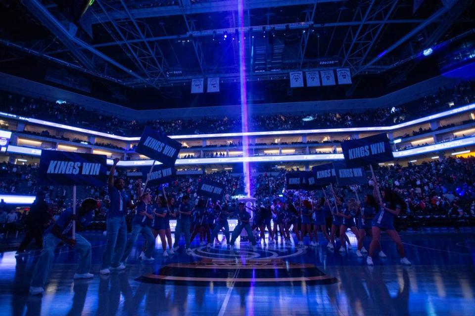 Sacramento Kings dancers cheer as the beam is lit to celebrate a win over the Oklahoma City Thunder at Golden 1 Center on Friday, Nov. 10, 2023.
