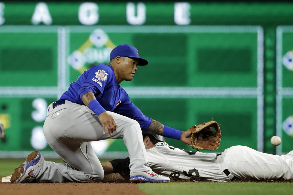 Chicago Cubs second baseman Addison Russell waits for the late throw from catcher Jonathan Lucroy as Pittsburgh Pirates' Adam Frazier steals second during the sixth inning of a baseball game in Pittsburgh, Thursday, Sept. 26, 2019. (AP Photo/Gene J. Puskar)