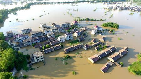 An aerial view shows a flooded village following heavy rainfall in Dongxiang district of Fuzhou, Jiangxi province, China July 8, 2018. REUTERS/Stringer