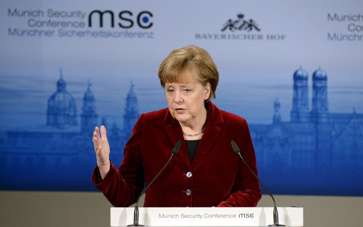 Angela Merkel delivers her speech during the 51st Munich Security Conference (MSC) in Munich. Russia has been accused of a “form of warfare” after the cyber attack - AFP