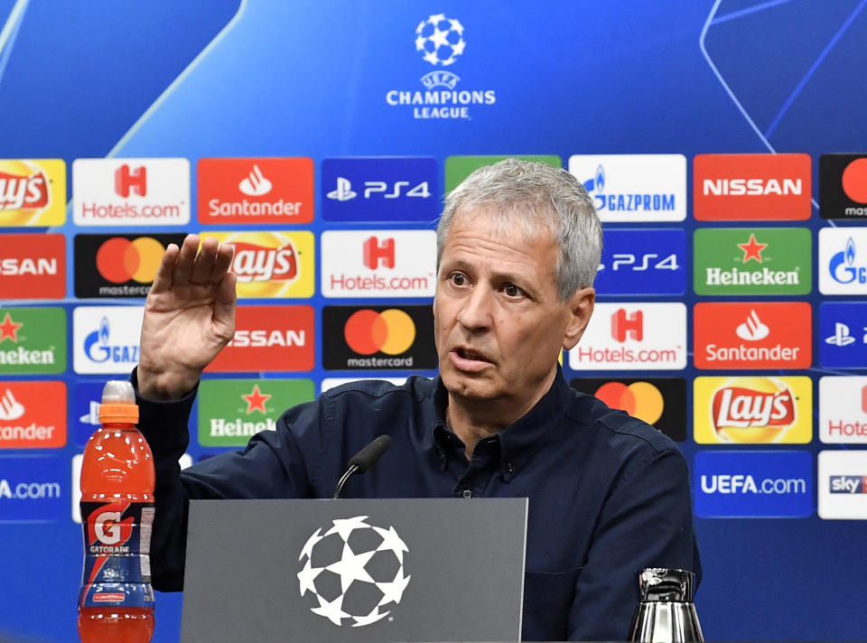 Dortmund coach Lucien Favre talks to the media at a press conference prior the Champions League group A soccer match between Borussia Dortmund and Atletico Madrid in Dortmund, Germany, Tuesday, Oct. 23, 2018. (AP Photo/Martin Meissner)