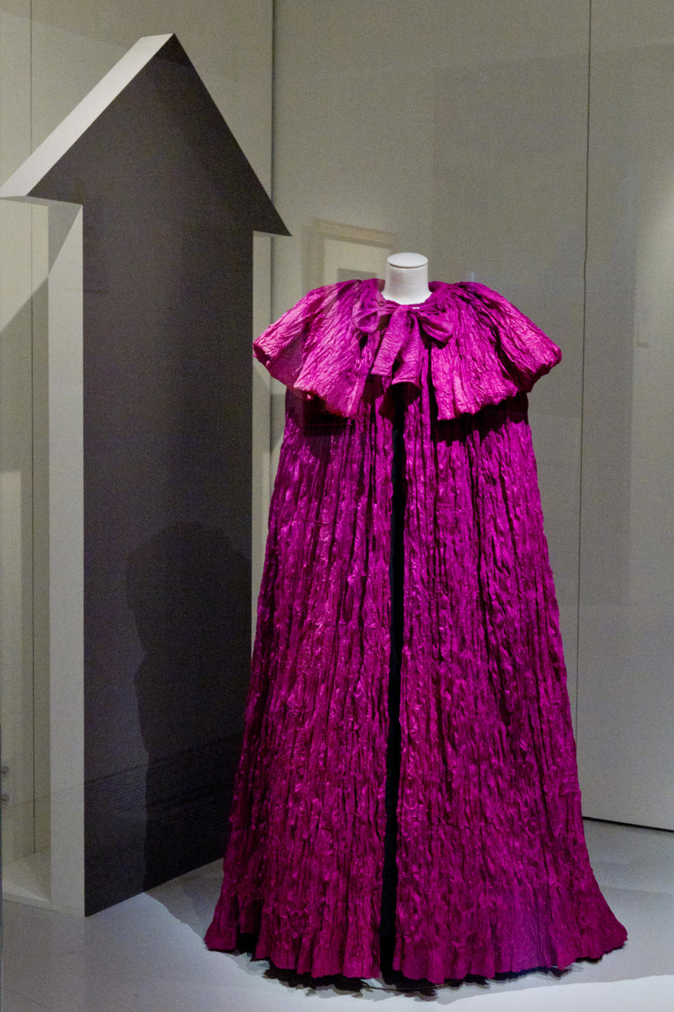 A shocking pink cape from 1951 in the Schiaparelli exhibition at the Musée des Arts Décoratifs.