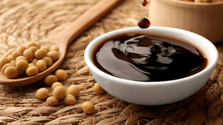 soy sauce drops falling into bowl