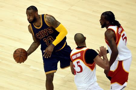 May 22, 2015; Atlanta, GA, USA; Cleveland Cavaliers forward LeBron James (23) passes against Atlanta Hawks center Al Horford (15) during the second half in game two of the Eastern Conference Finals of the NBA Playoffs at Philips Arena. Dale Zanine-USA TODAY Sports