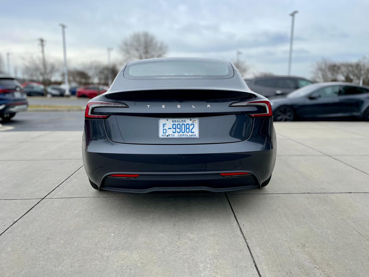 a back of a black Tesla Model 3