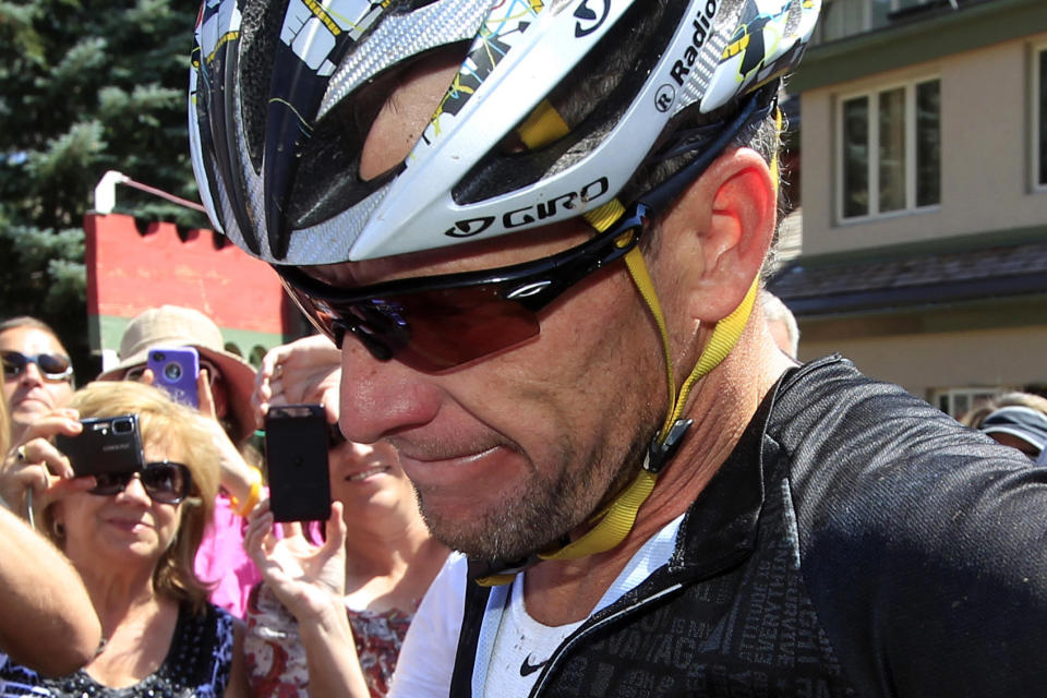 In this Aug. 25, 2012, file photo, Lance Armstrong considers a question from a reporter after his second-place finish in the Power of Four mountain bicycle race at the base of Aspen Mountain in Aspen, Colo. 