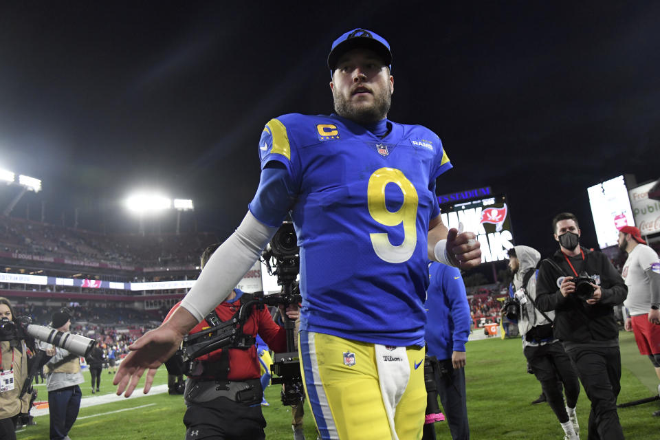 Los Angeles Rams quarterback Matthew Stafford (9) celebrates as he leaves the field after the team defeated the Tampa Bay Buccaneers during an NFL divisional round playoff football game Sunday, Jan. 23, 2022, in Tampa, Fla. (AP Photo/Jason Behnken)