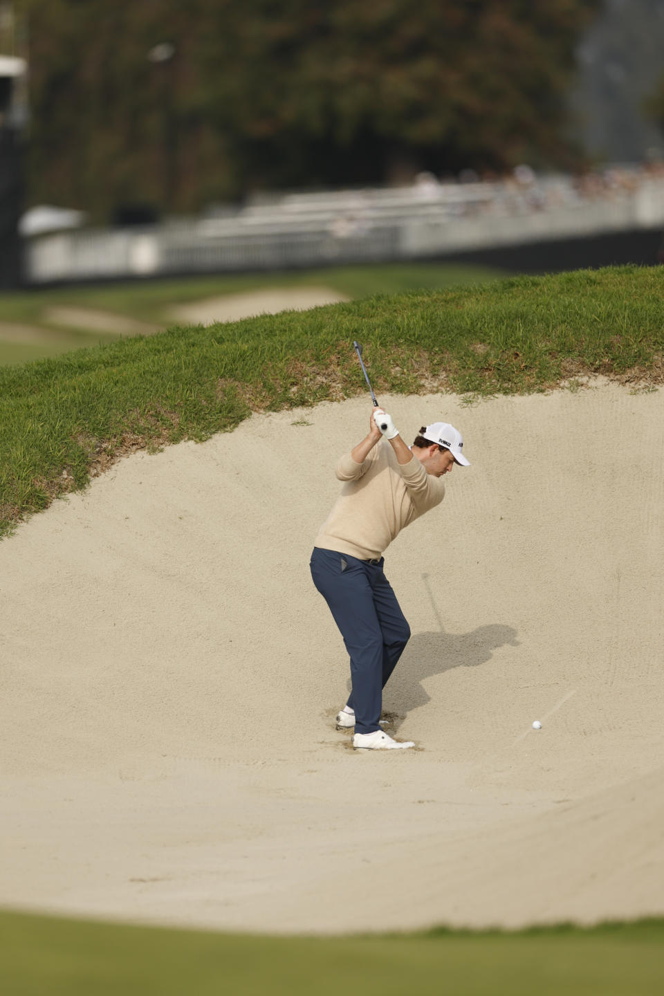 Patrick Cantlay hits out of a fairway bunker on the 17th hole during the third round of the Genesis Invitational golf tournament at Riviera Country Club, Saturday, Feb. 17, 2024, in the Pacific Palisades area of Los Angeles. (AP Photo/Ryan Kang)