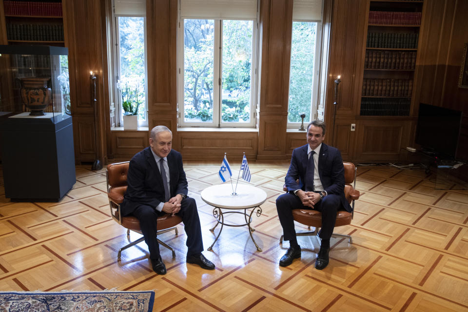 Greece's Prime Minister Kyriakos Mitsotakis, right, meets his Israeli counterpart Benjamin Netanyahu in Athens, Thursday, Jan. 2, 2020. The leaders of Greece, Israel and Cyprus will meet in Athens Thursday to sign a deal aiming to build a key undersea pipeline, named EastMed, designed to carry gas from new rich offshore deposits in the southeastern Mediterranean to continental Europe.(AP Photo/Yorgos Karahalis)