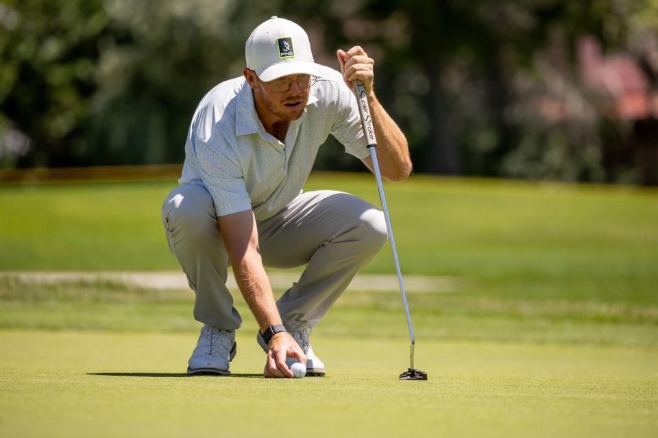 Mitchell Schow lines up his putt during the Utah Championship, part of the PGA Korn Ferry Tour, at Oakridge Country Club in Farmington on Saturday, Aug. 5, 2023. | Spenser Heaps, Deseret News